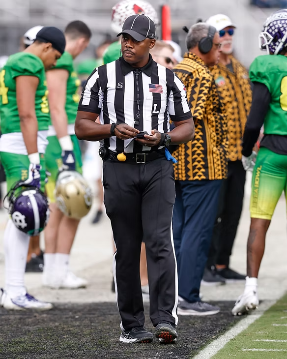 Kristopher Loving, Sr. on the sideline as a Big Ten football official